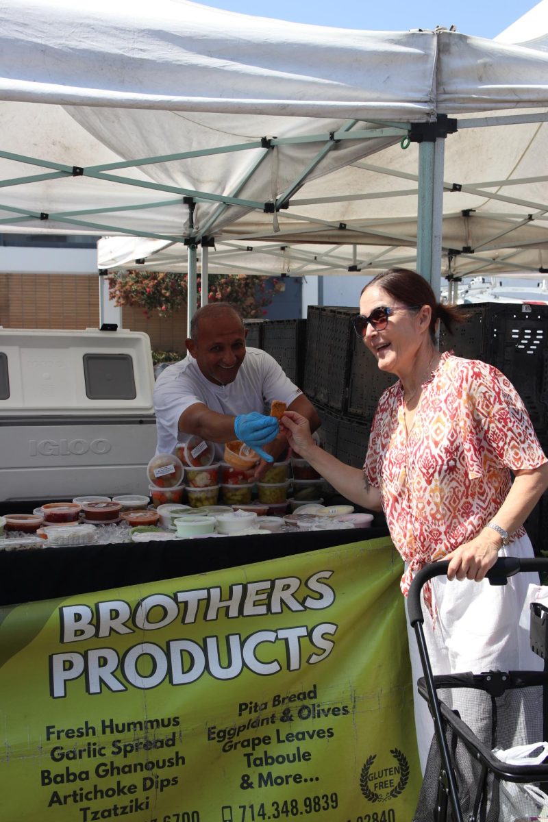 Posing with her favorite stall “Brothers’ Products”, Ramie Johnson, a customer at the Downey Farmers’ Market on August 31st expresses why she continues to return. “Everything here is super fresh,” Johnson stated. “And it saves me a ton of money!”