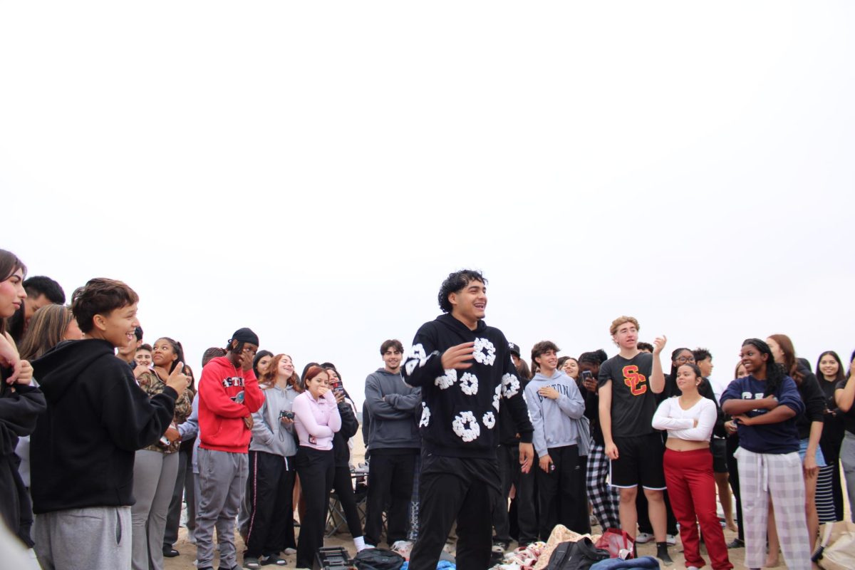 Bringing together the senior class of '25 at Bolsa Chica Beach Tower 20, Jeff Flores, 12, gives commencement to the traditional senior sunrise to mark the beginning of our last year of high school on Saturday, August 31, 2024. “My expectations for senior year are to have a good time, enjoy it,” Flores stated “We only live senior year once.”
